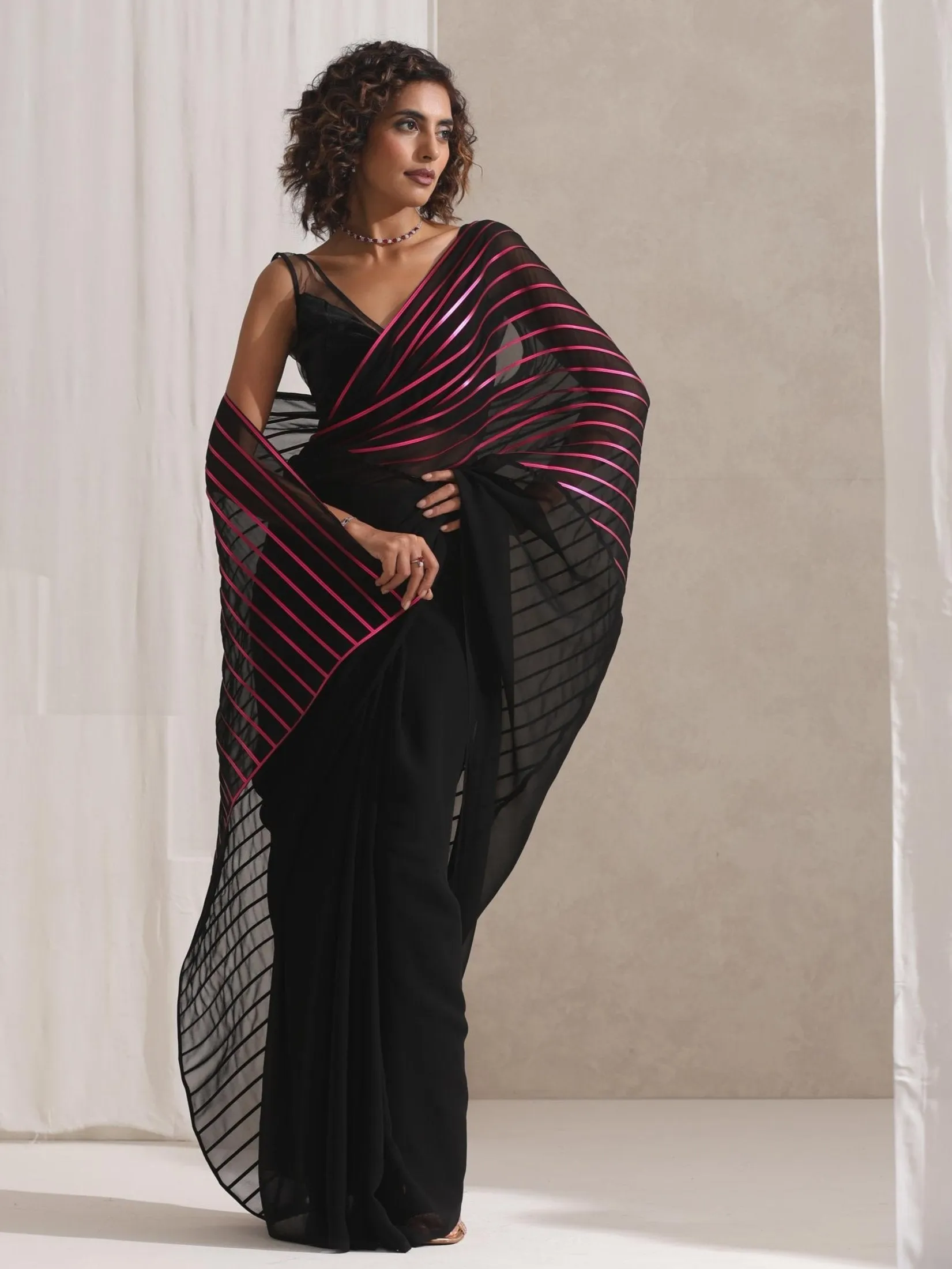 Black and Pink Impression Georgette Saree