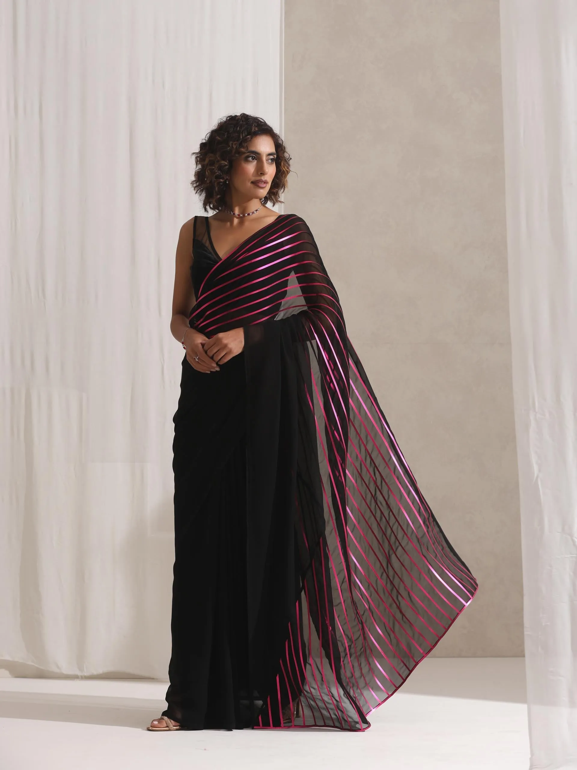 Black and Pink Impression Georgette Saree